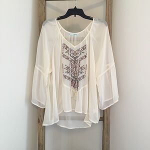Sheer, flowy Maurice’s top with stitching